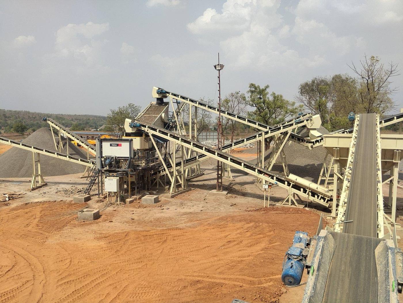CC Patel plant — full exterior view with Metso crusher line and stockpiles